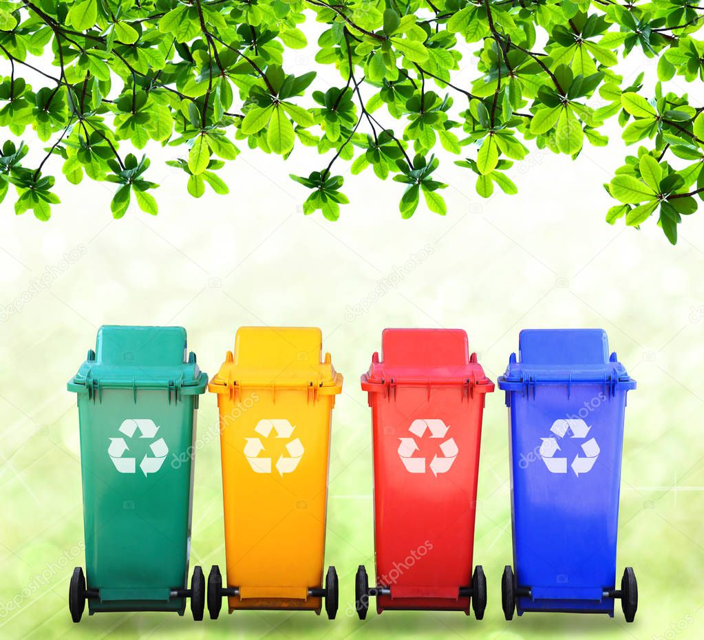Red yellow blue and green bins with logo on nature background, image for design and other.