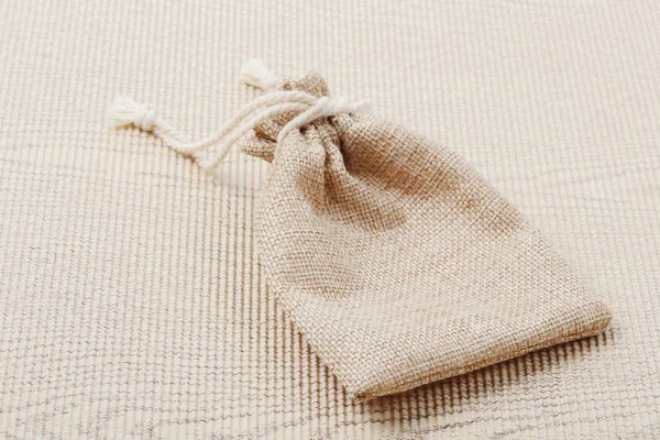 Empty burlap sack on corrugated paper