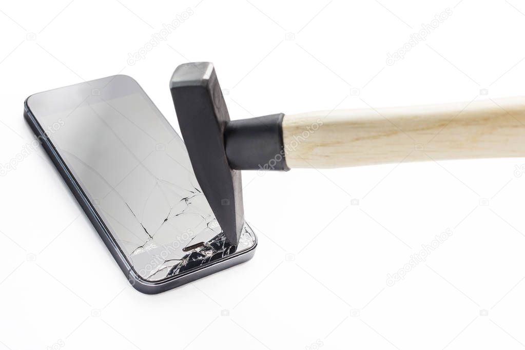 A hammer breaks the phone on a white background.