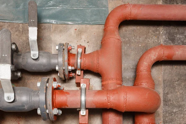 Pipes of hot water supply on the technical floor.