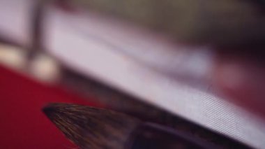 Kutusu ve painbrush bir hat yakın çekim makro için