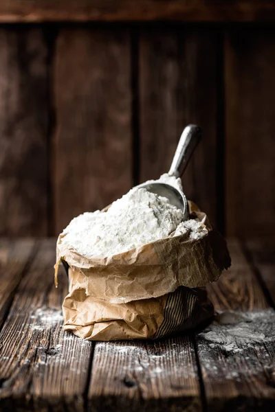 Flour on wooden rustic background — Stock Photo, Image