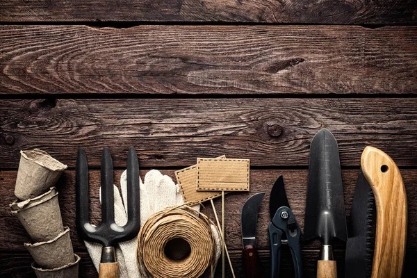 Gardening Tools Dark Wooden Background Space Text Top View — Stock Photo, Image