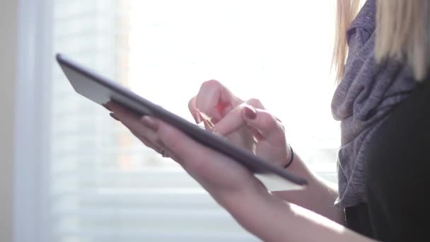 Female Swiping Across Her Tablet — Stock Video