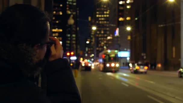 Male Photographer Taking Photo Downtown Street Night — Stock Video