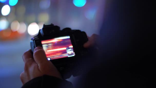 Photographer Reviewing Pictures Camera Beautiful Bokeh Lights Background Night — Stock Video