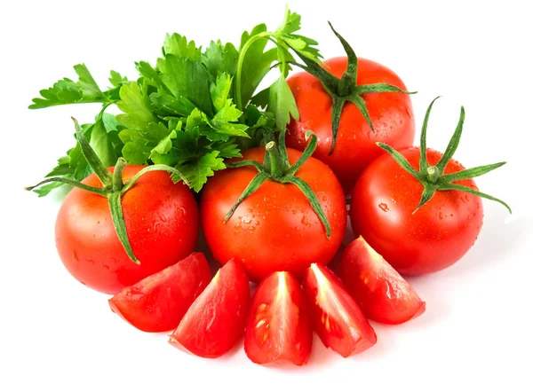 Delicious fresh red tomatoes with parsley leaves on a white isolated background — Stock Photo, Image