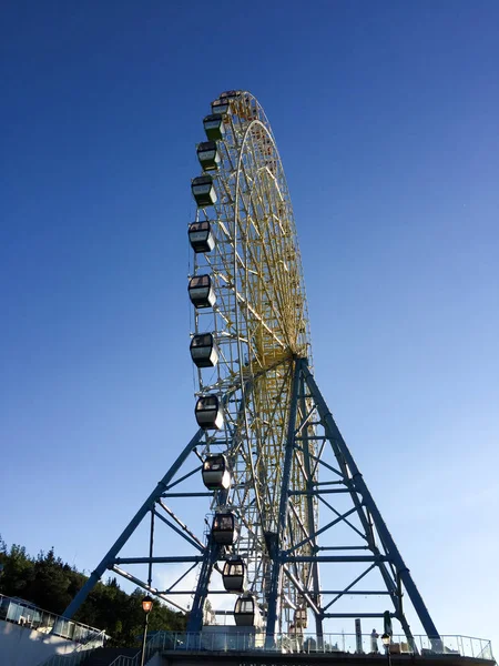 Ferris wheel over a blue sky — Stock Photo, Image