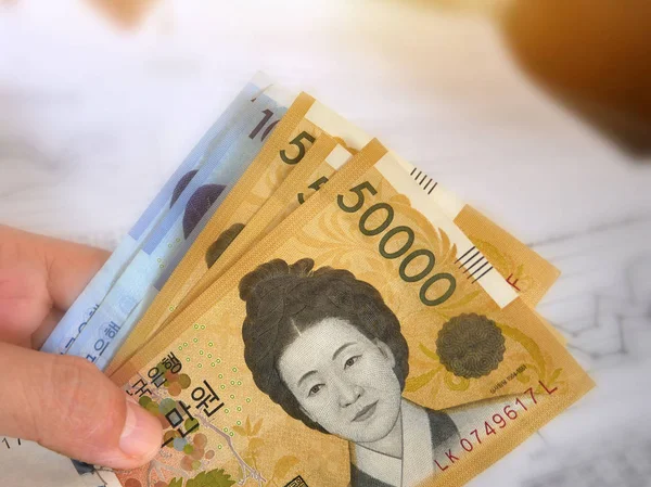 Korean money on finance account background.