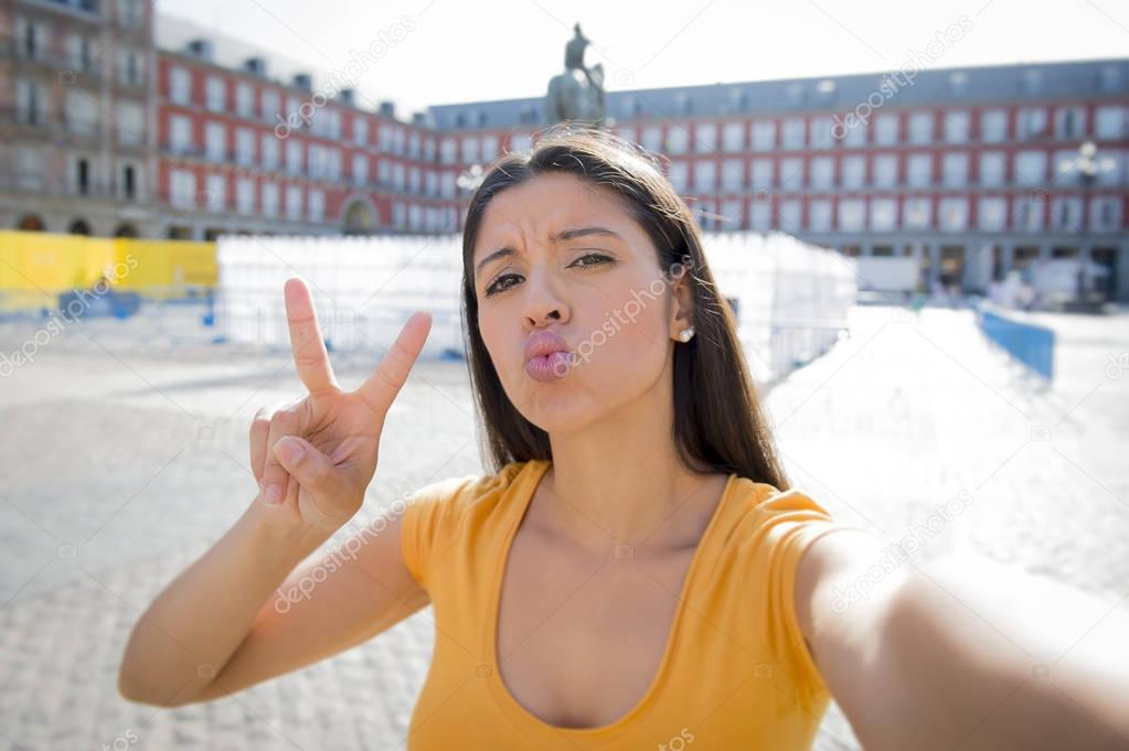 attractive latin woman talking selfie