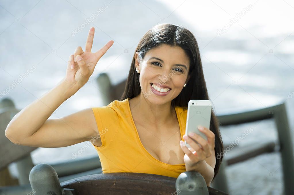 girl giving peace sign