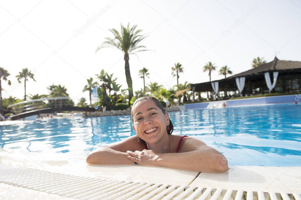 woman smiling in a swimming pool 