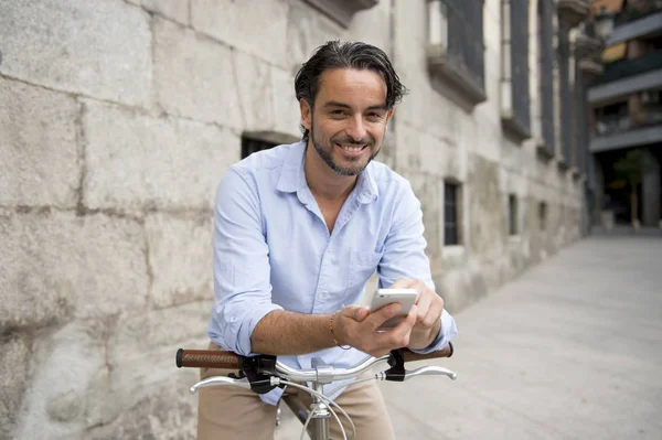 man using phone on vintage bicycle