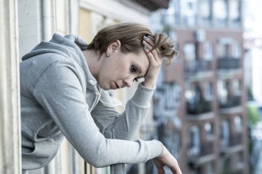 young beautiful, unhappy depressed lonely woman staring hopeless and worried on the balcony at home. having feelings of failure, pressure. Adult life style problems, depression concept clipart