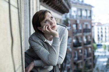 young beautiful, unhappy depressed lonely woman staring hopeless and worried on the balcony at home. having feelings of failure, dissatisfaction. Adult life style problems, depression concept clipart
