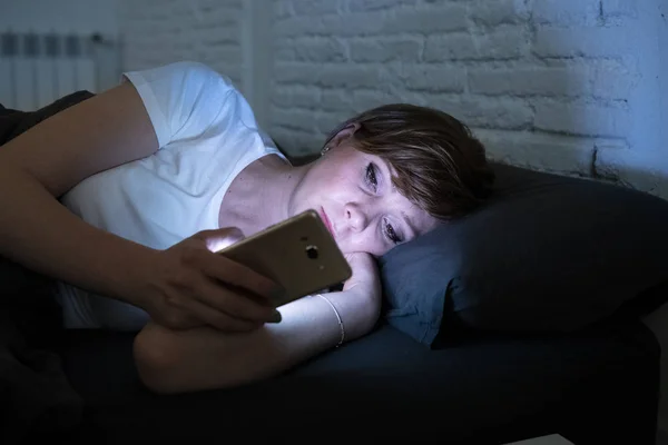 Young Attractive Woman Awake Late Night Using Smart Phone Lying — Stock Photo, Image
