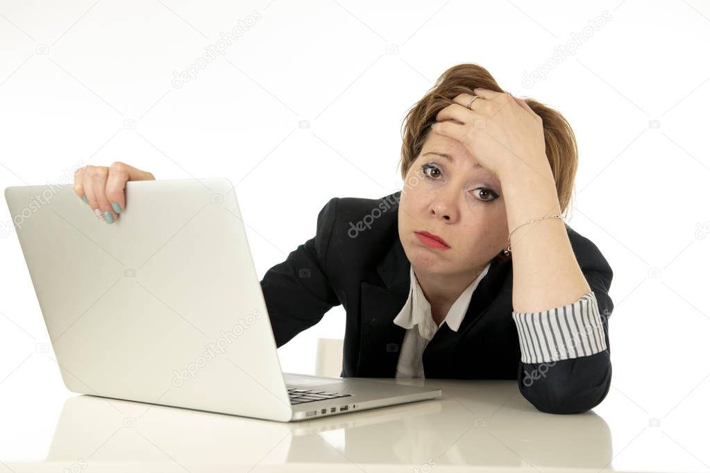 Young beautiful caucasian stressed business woman working on her laptop looking worried, tired, overwhelmed and unhappy. Business, overwork, deadline and technology concept.