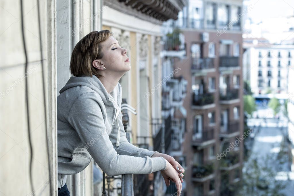 young beautiful, unhappy depressed lonely woman staring hopeless and worried on the balcony at home. having feelings of failure, pressure. Adult life style problems, depression concept