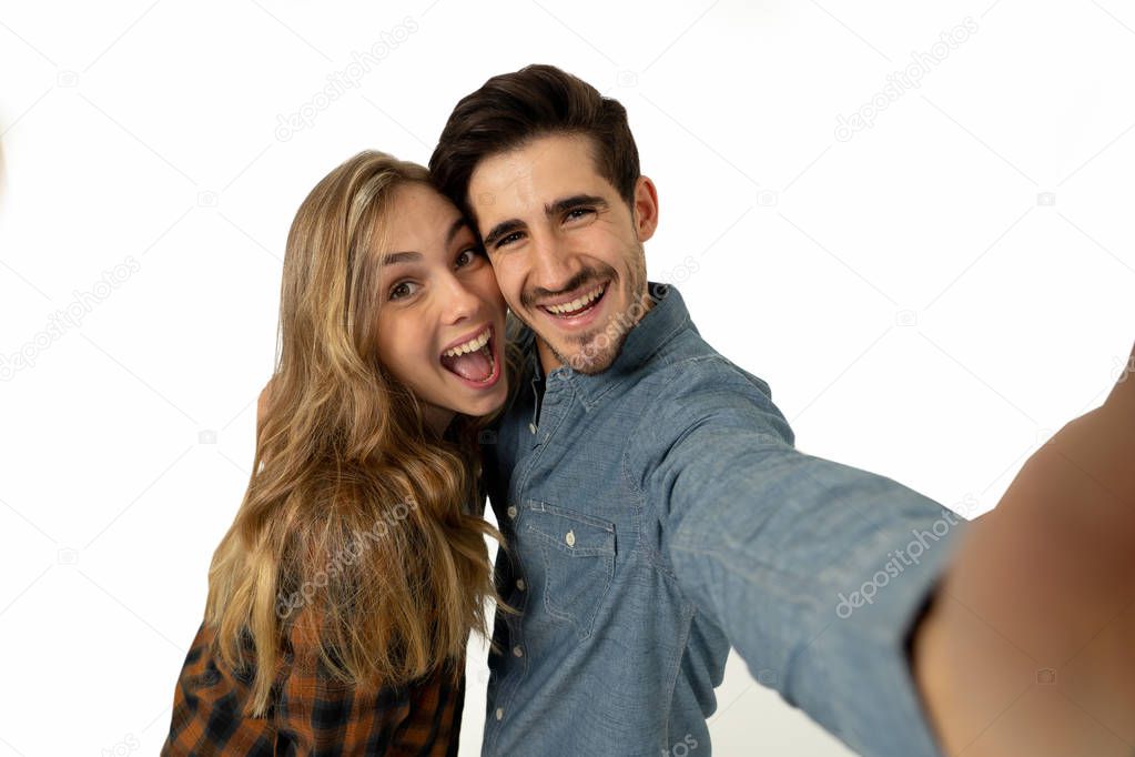 Friends tourist couple in love taking selfies in a romantic vacation. Travel industry and technology advertising style image isolated on white. In Tourism, travel destination and vacation concept.