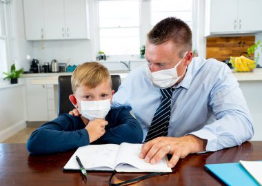 Coronavirus Outbreak school shutdowns. Stressed parent coping with remote work and homeschooling worried about COVID-19 pandemic. Father and son with mask in quarantine working and learning from home. clipart