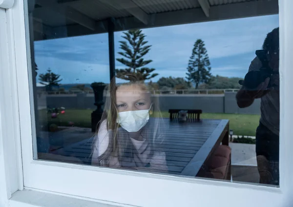 Covid Lockdown Depressed Lonely Little Girl Face Mask Looking Window — Stock Photo, Image