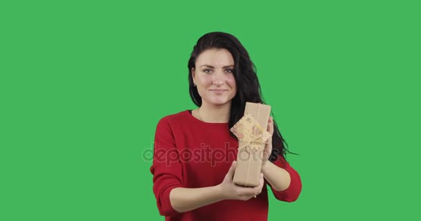 Brunette Woman Holding Present Green Background — Stock Video