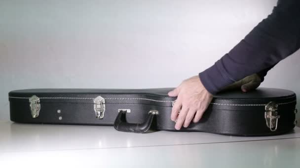 Man Hands Open Case Takes Guitar Out Case — Stock Video