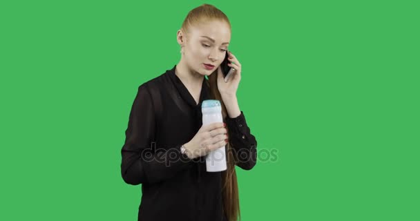 Girl Thermos Uses Smartphone Green Chroma Key Background — Stock Video