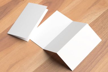 Thrifold - üç broşür sahte ahşap arka plan üzerine katlayın. 3D 