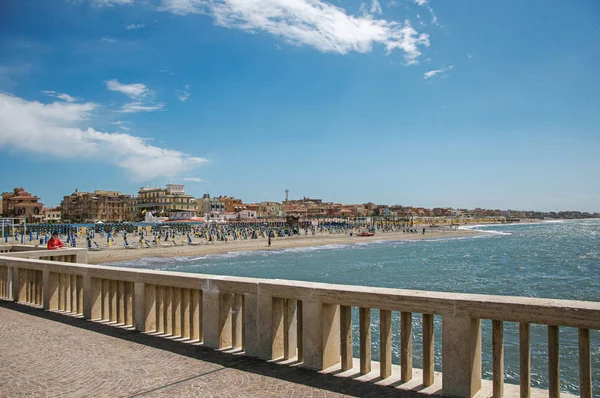 View of marble pier, with the beach and the city of Ostia — Stock Photo, Image