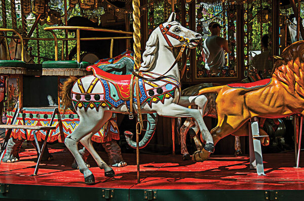 Carousel white horse in a park in the city of Annecy, France
