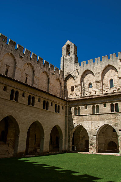 View of courtyard and internal buildings of the Palace of the Popes of Avignon.