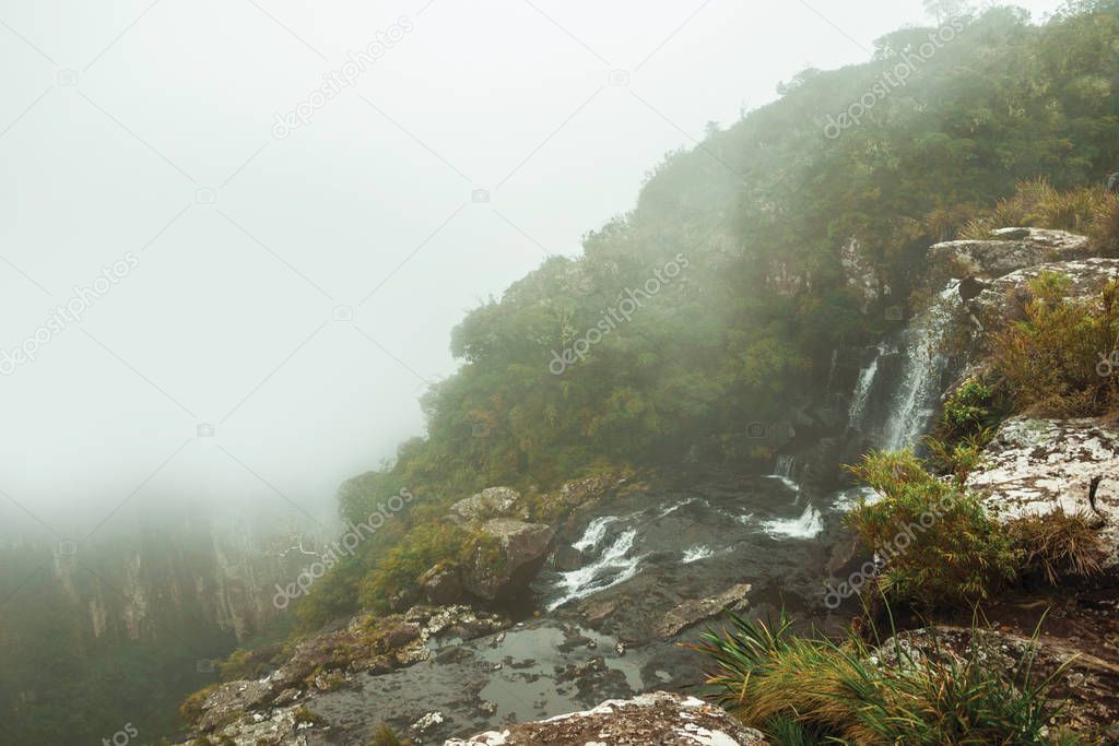Black Tiger waterfall on cliff with mist