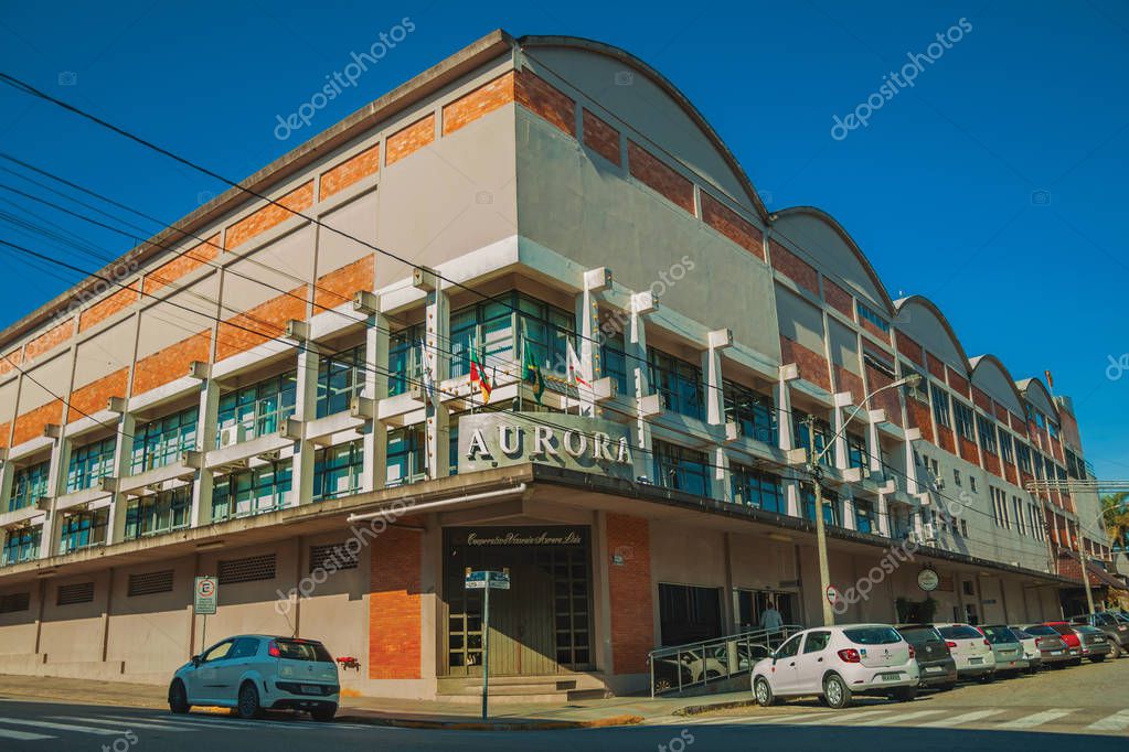 Bento Goncalves, Brazil - July 11, 2019. Facade of Aurora Winery building with the company signboard in a street of Bento Goncalves. A friendly country town famous for its wine production.