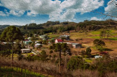 Ormanı ve yolu olan bir vadideki kır evleri.