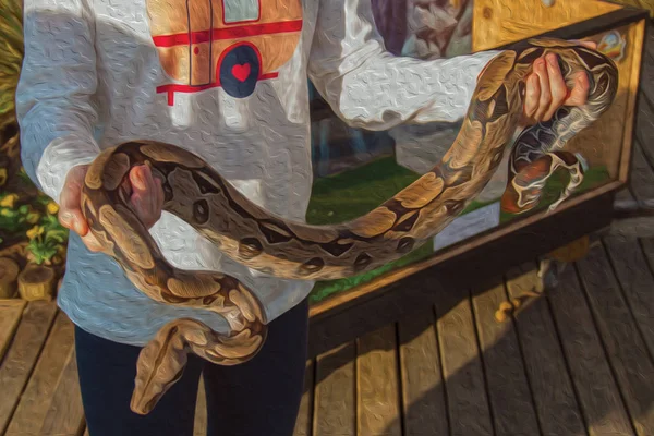 Little girl holding a small boa constrictor — Stock Photo, Image