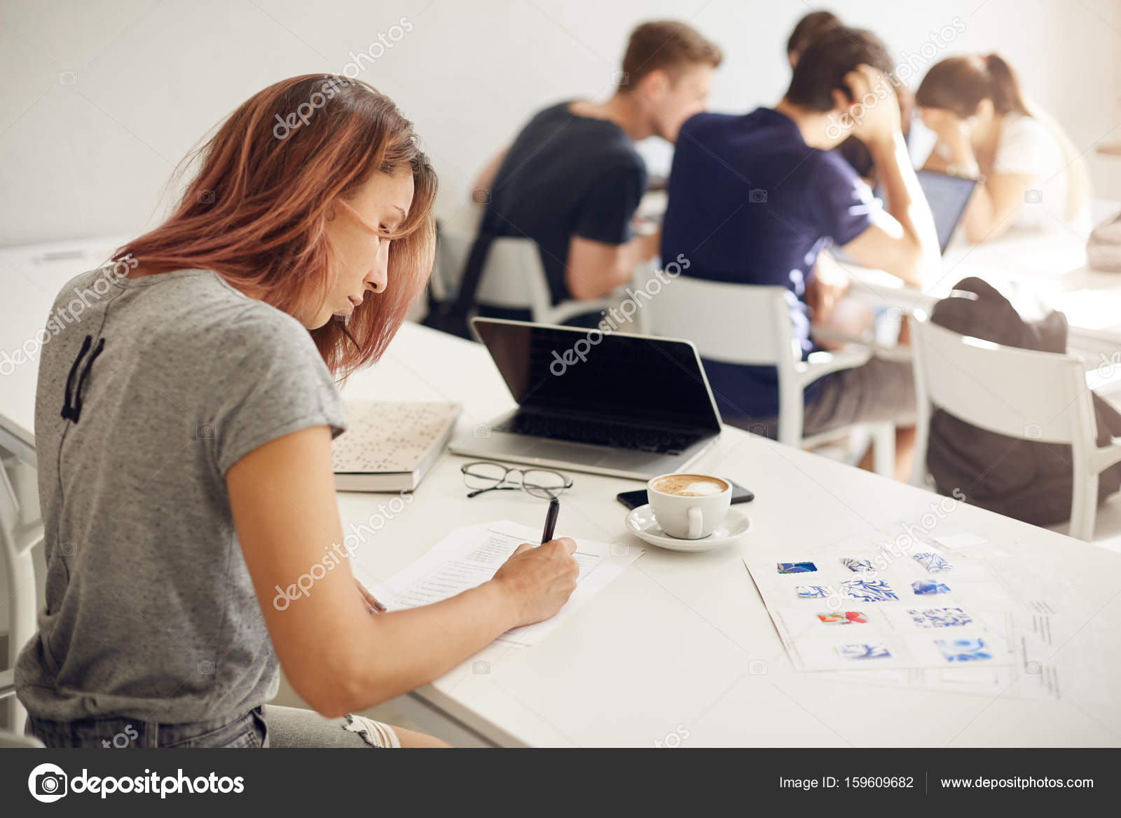Interior Design Student Filling Out Forms Working In A