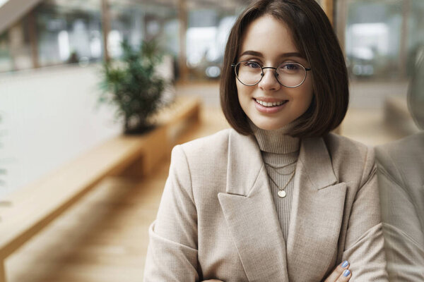 Close-up portrait of adult attractive young businesswoman, girl working in company, wear blazer, cross hands chest and smiling pleased, headhunter searching new candidates Royalty Free Stock Photos