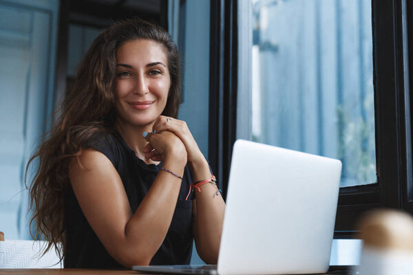 Self isolation and distancing, working at home concept. Smiling young manager, woman apply for online courses via computer, sit at home open laptop, learn new things while on covid19 quarantine Stock Image