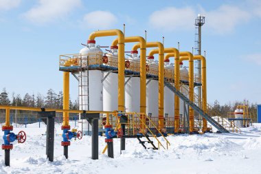 Construction of the pipeline during the winter day in Siberia clipart