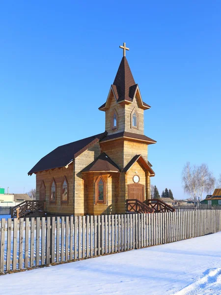 Wooden Evangelical Lutheran Church in winter in the village of N — Stock Photo, Image