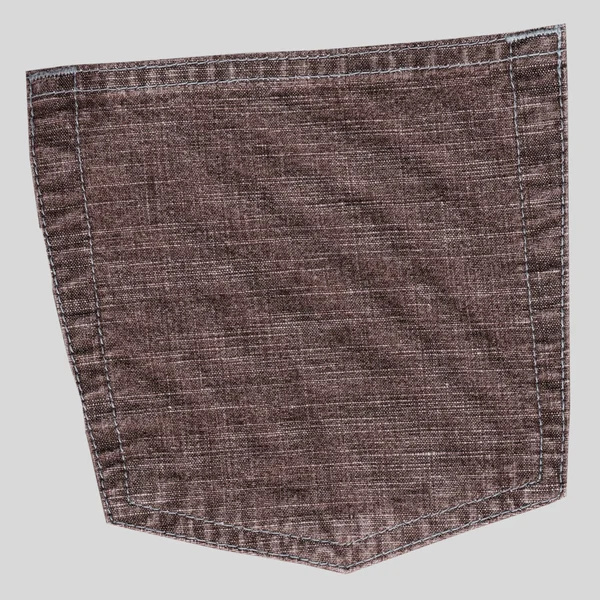 Achterzak bruine jeans broek geïsoleerd op grijs — Stockfoto