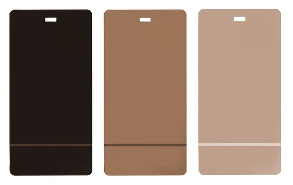 Three brown cardboard tags of different tint — Stock Photo, Image
