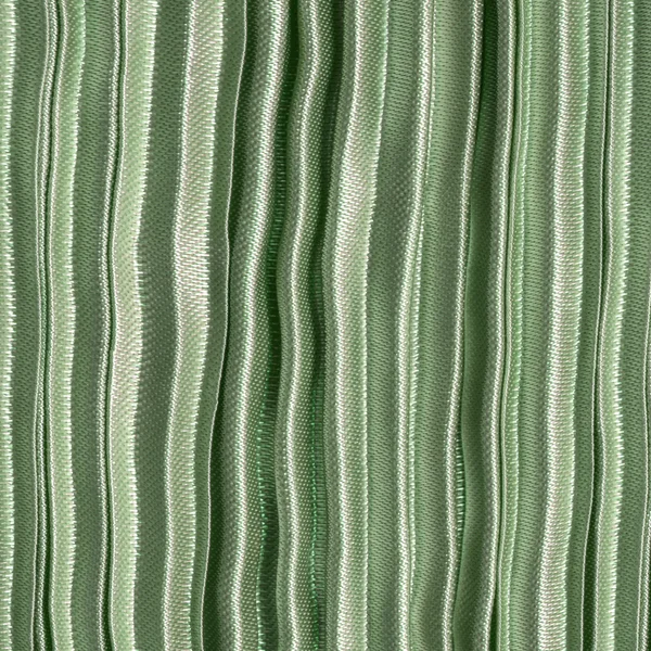 Зелена плісирована текстура тканини крупним планом . — стокове фото