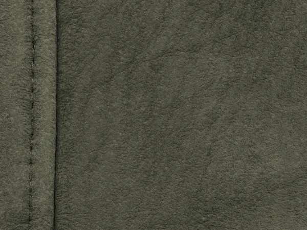 Green roughly dressed leather texture,seam — Stock Photo, Image