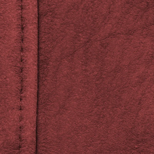 Vermelho grosseiramente vestido textura de couro, costura — Fotografia de Stock