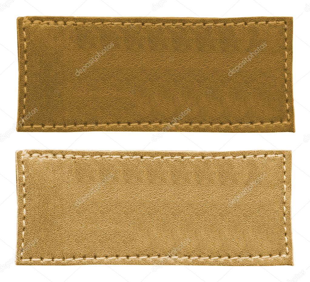 two blank brown  leather labels of different tint on white