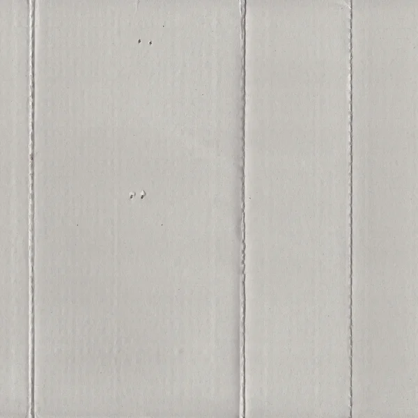 Gray cardboard texture,folds,holes — Stock Photo, Image
