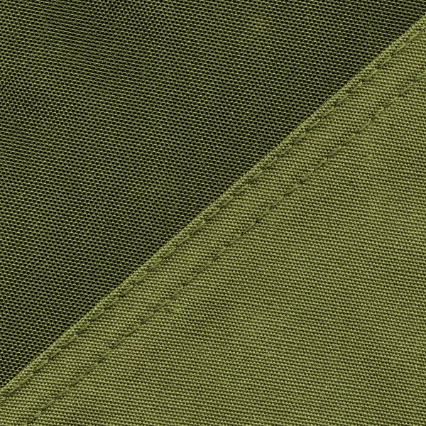 Grüner textiler Hintergrund mit zwei Tönungen. — Stockfoto
