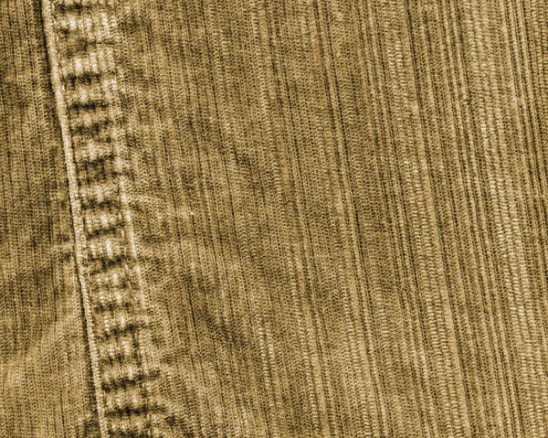 El fragmento de los vaqueros amarillentos-castaños, la costura — Foto de Stock